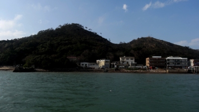Old buildings in Tai O seen from a boat.